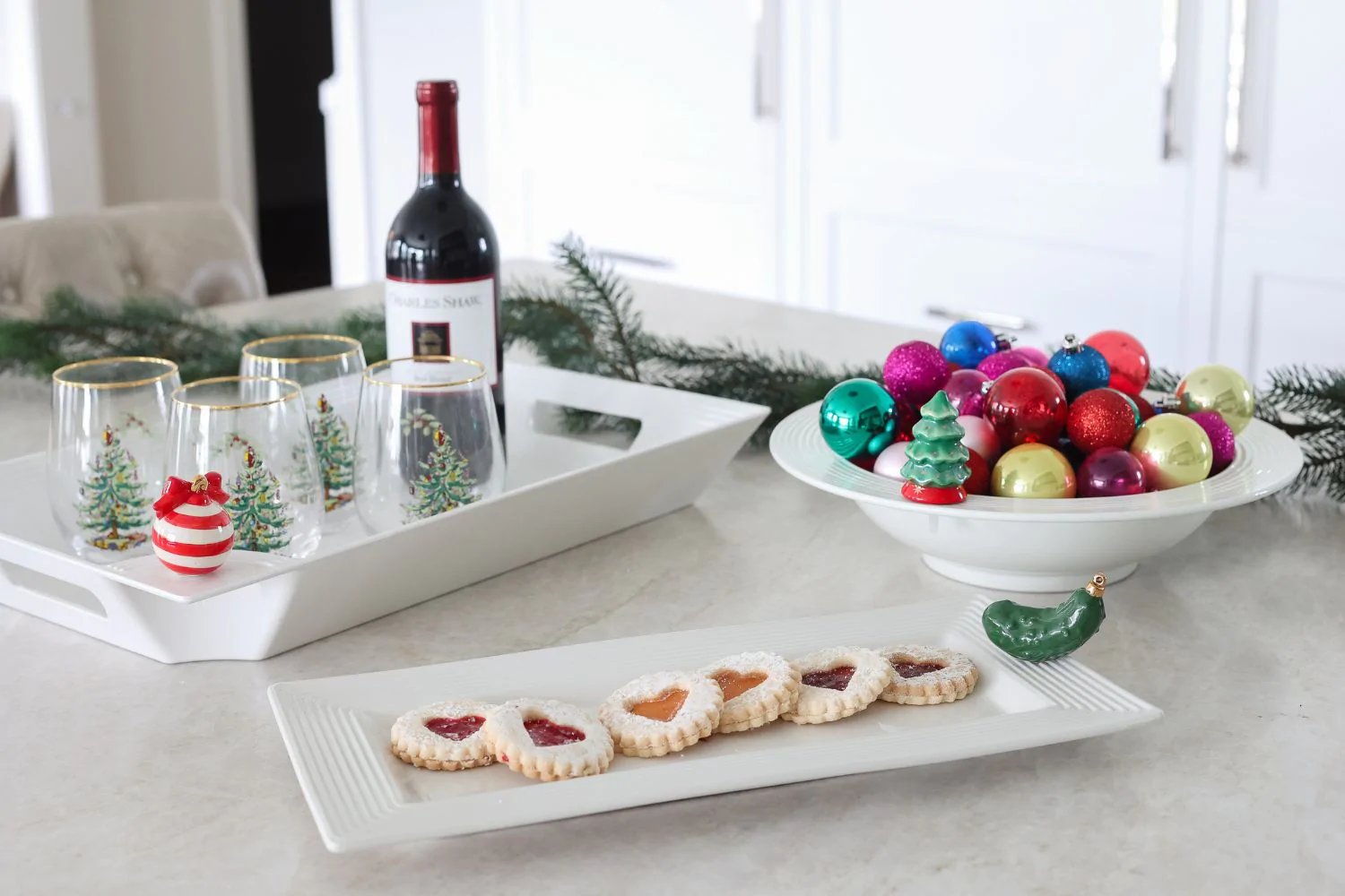 Nora Fleming trays and minis showing the Christmas Pickle attached to a cookie tray