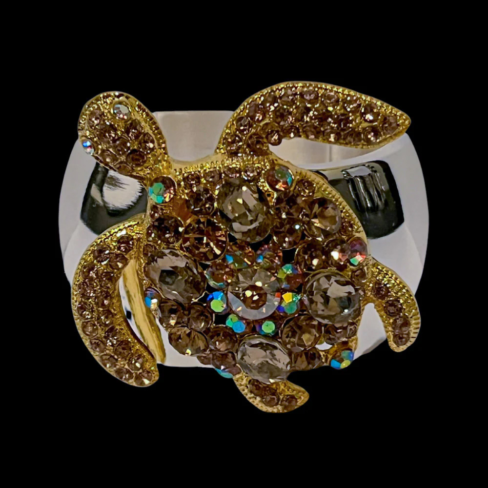 Isabella Adams Sea Turtle Napkin Ring Featuring Topaz Premium Crystal turned so the sea turtle faces the camera